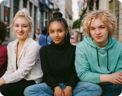 Alt Text: A boy with two girls